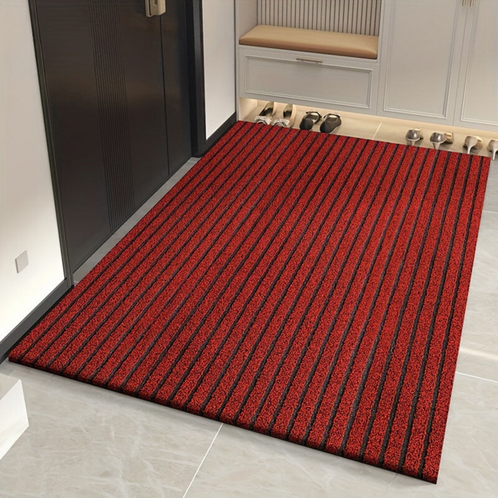 Heavy-duty all-weather non-slip entrance mat. Durable ribbed outdoor rug keeps entryway clean year-round.