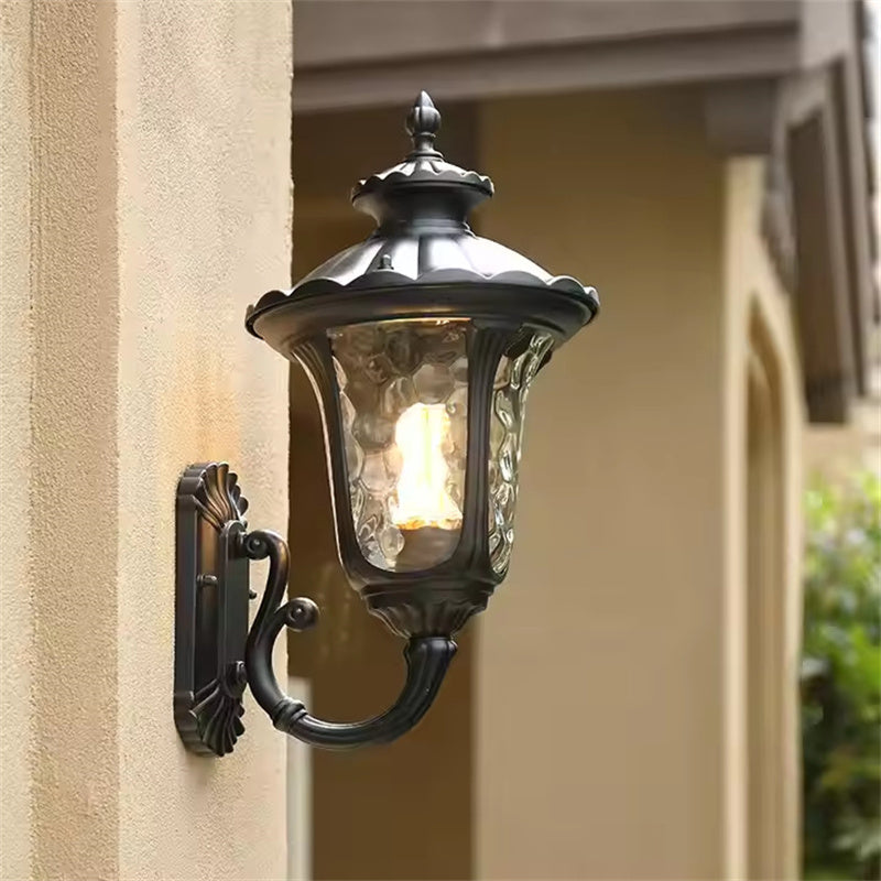Durable outdoor waterproof wall light with glass shade, perfect for garden areas.