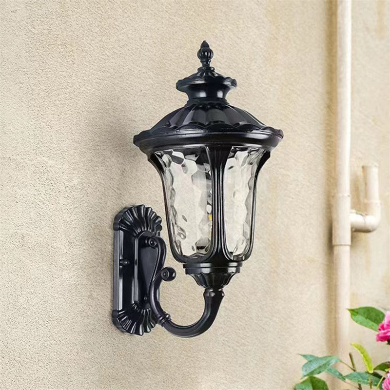 Clear glass shade outdoor wall light, waterproof bronze finish for home exterior.