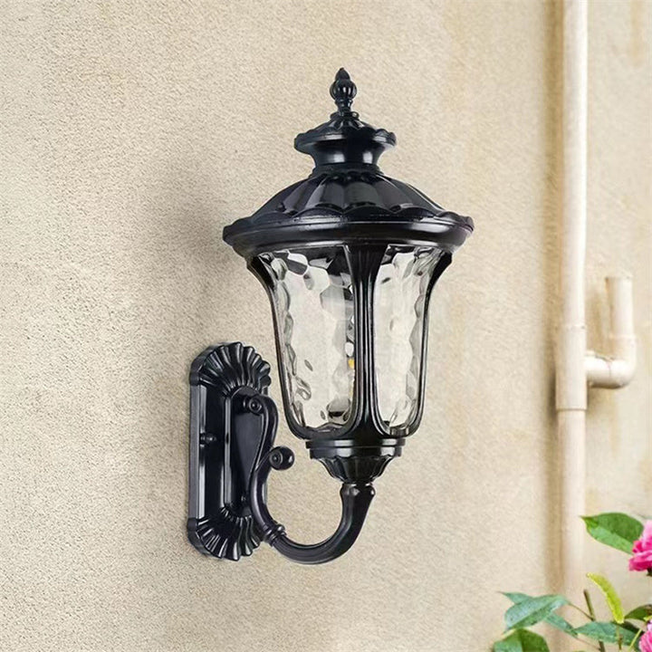 Clear glass shade outdoor wall light, waterproof bronze finish for home exterior.