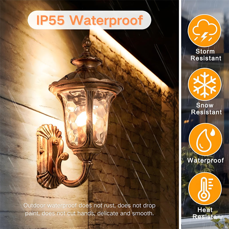 Bronze outdoor wall light with glass shade, weather-resistant for garden lighting.