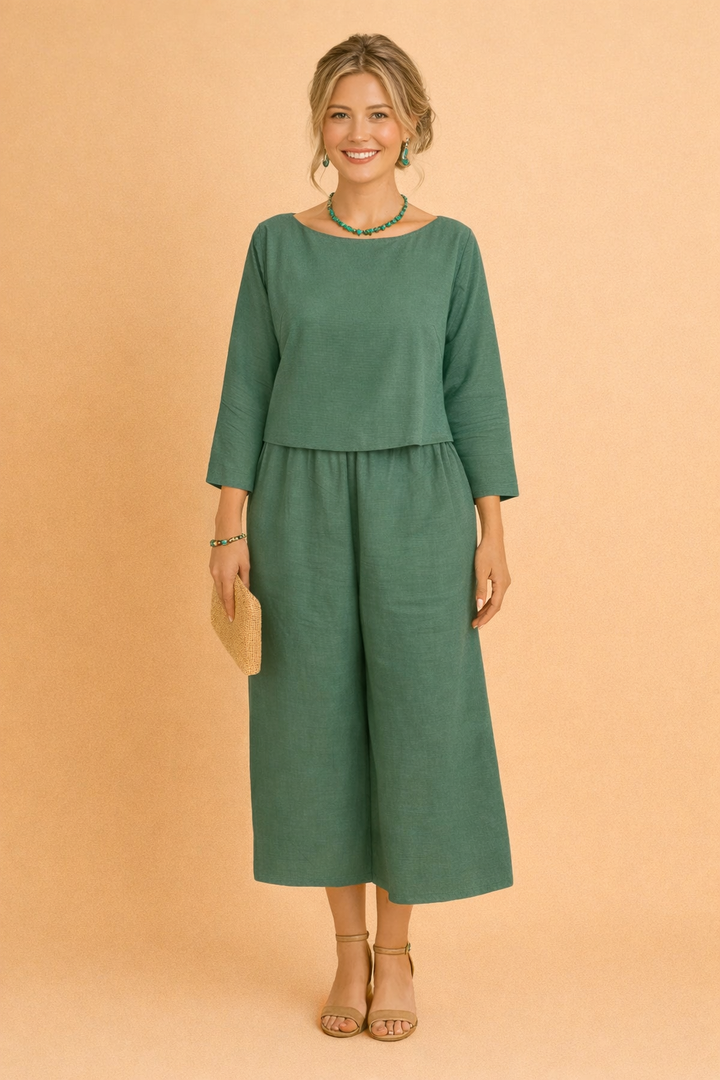 Chic women's comfortable blouse and trousers set. Stylish ladies two-piece apparel for spring fashion.