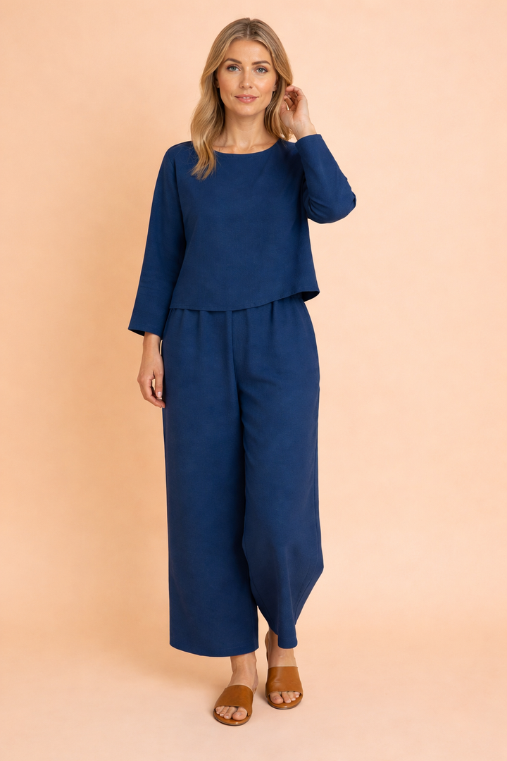Elegant women's two-piece blouse & trousers set. Effortless casual chic summer outfit for women's fashion.