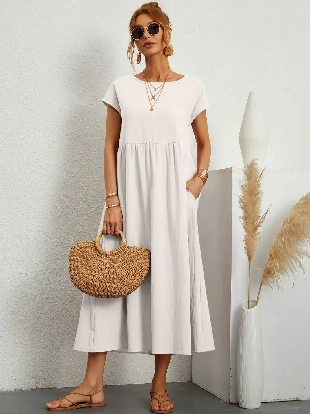 Effortless flowy elegant midi dress for women, perfect for summer casual or occasion wear.