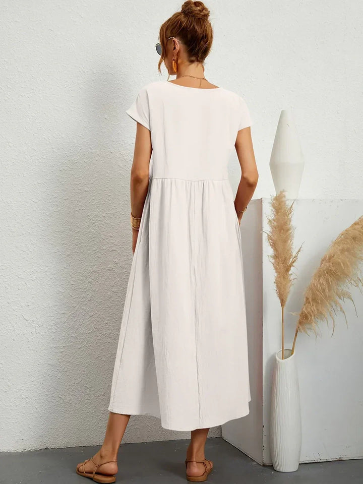 Elegant women's midi dress with a comfortable flowy design, great for any occasion.