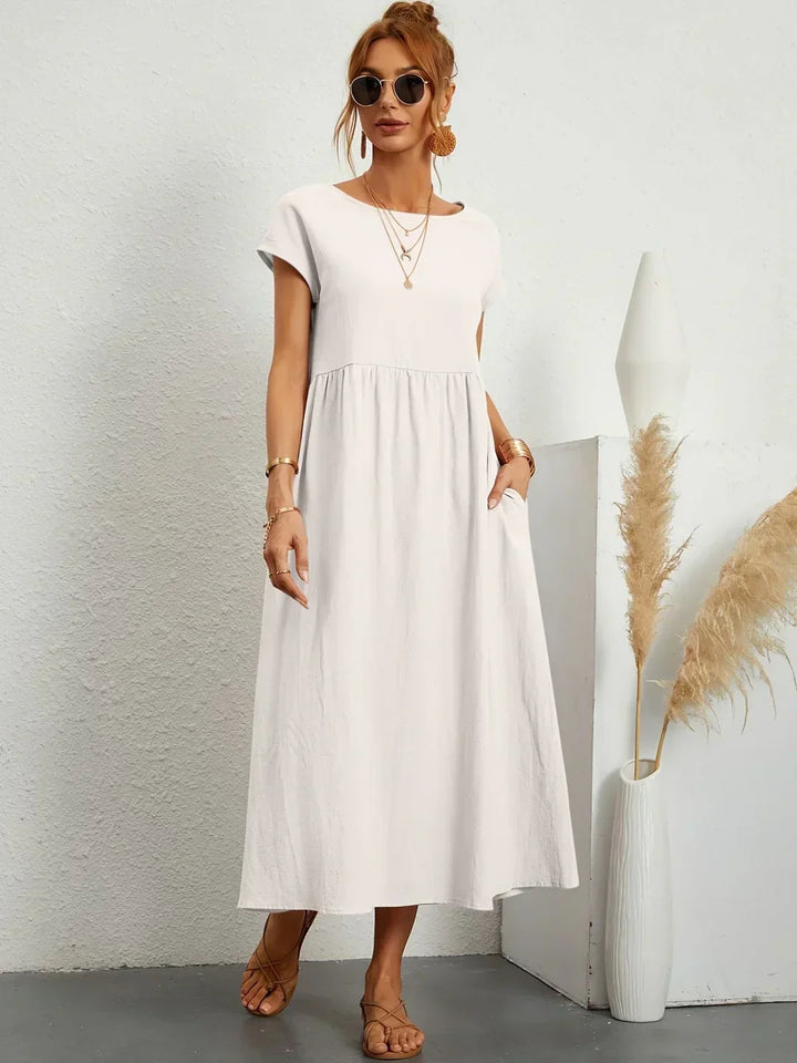 Timeless women's elegant midi dress, flowy and effortless, suitable for versatile styling.