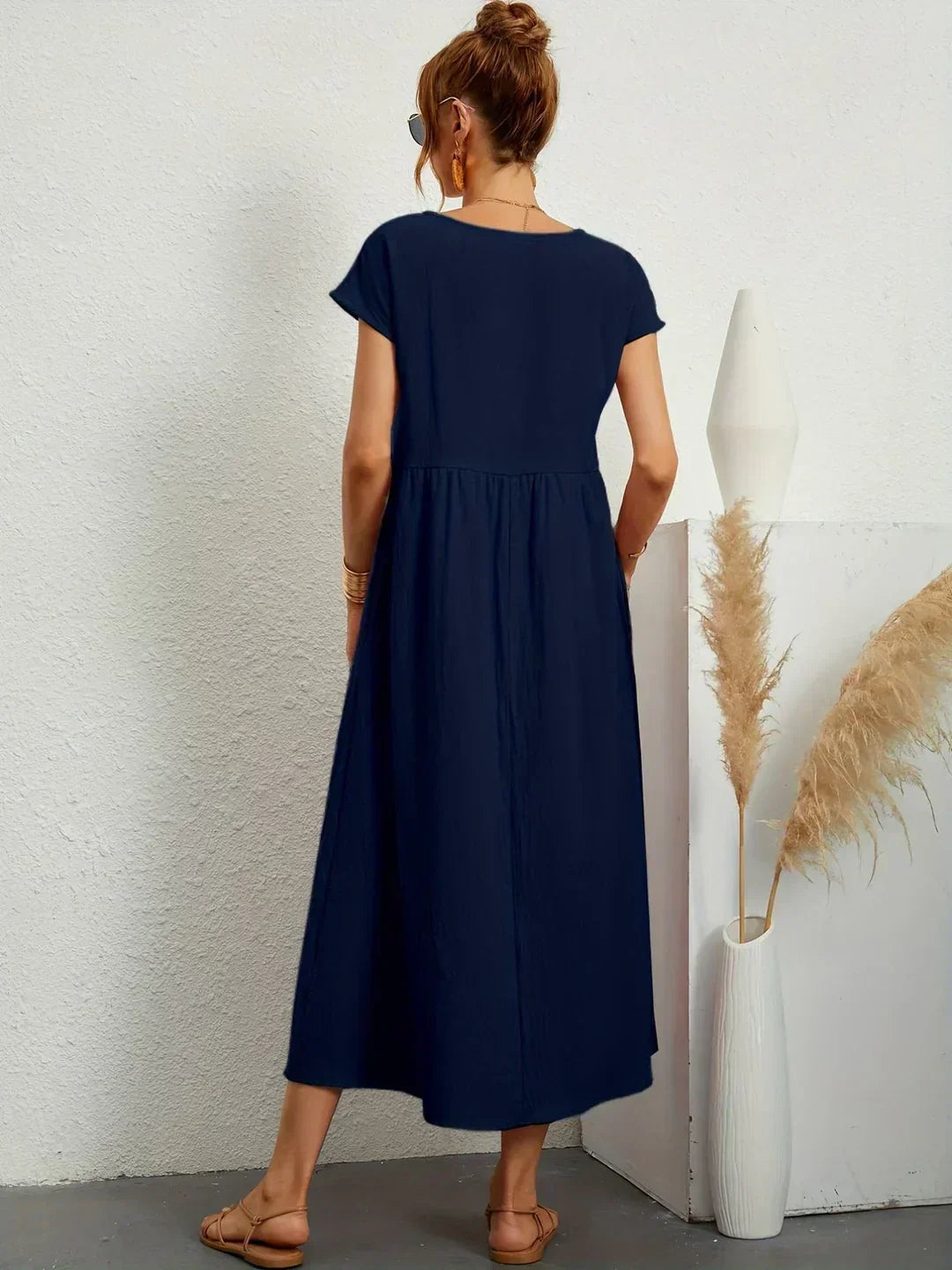 Casual yet elegant flowy midi dress for women, offering comfortable and timeless style.