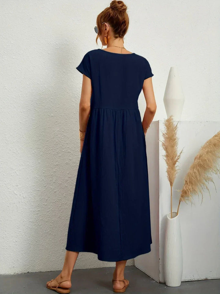 Casual yet elegant flowy midi dress for women, offering comfortable and timeless style.
