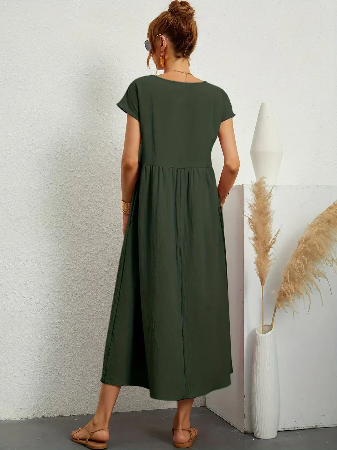 Flowy women's summer midi dress, an elegant and comfortable choice for versatile wear.