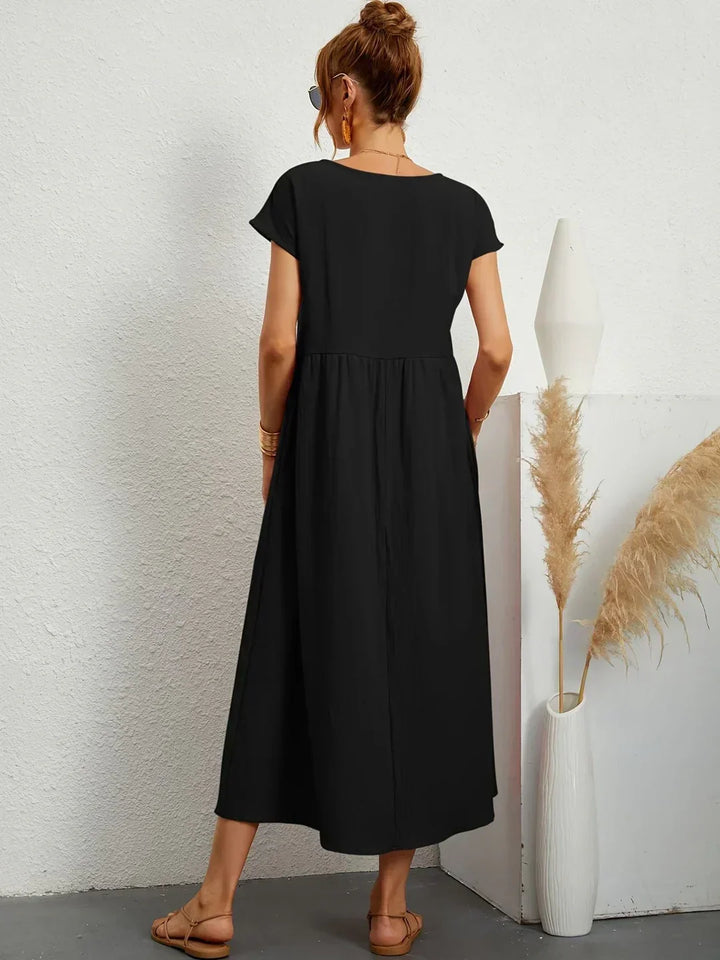 Comfortable and elegant flowy midi dress for women, ideal for versatile summer styling.