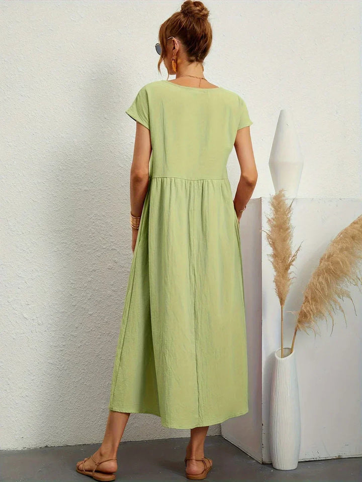 Versatile women's elegant midi dress, a comfortable flowy design for summer and occasion wear.