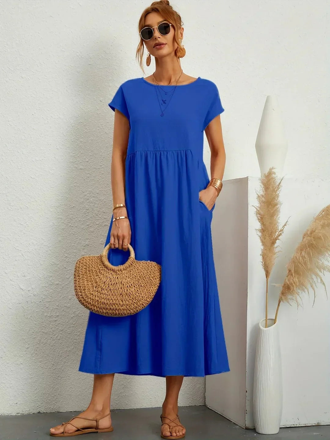 Elegant women's flowy midi dress, perfect for effortless comfort and timeless summer style.