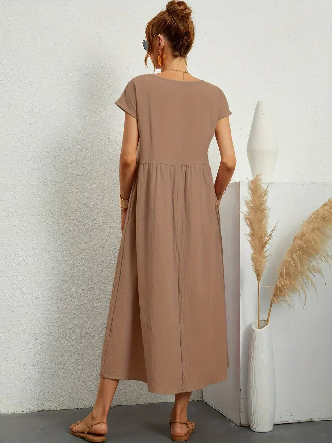 Summer elegant flowy midi dress for women, offering versatile comfort and timeless style.