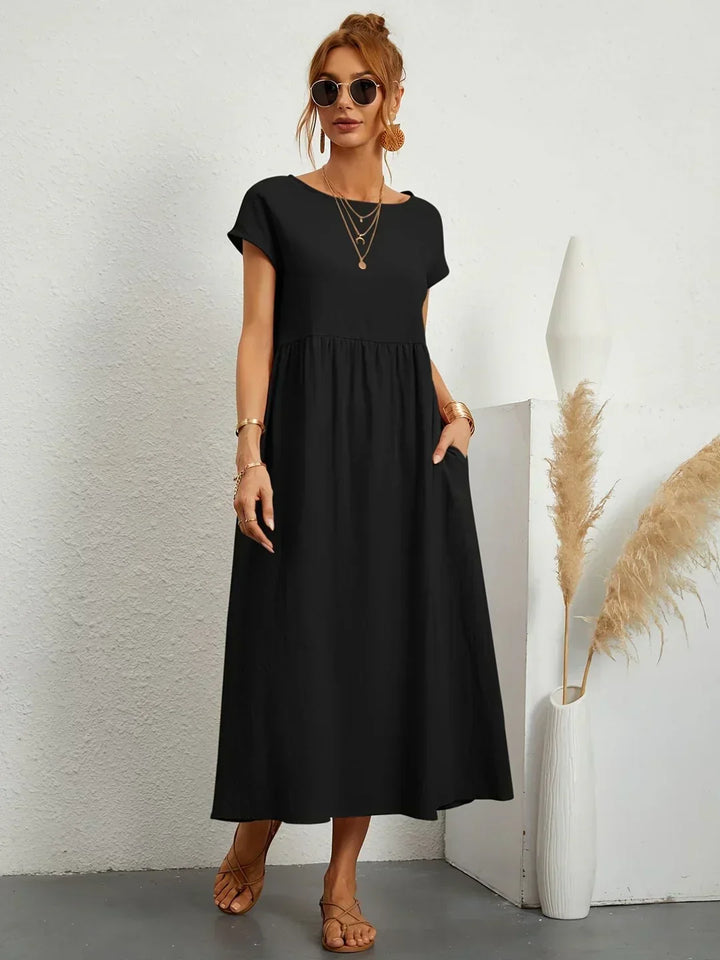 Comfortable women's flowy midi dress, elegant and versatile, perfect for effortless occasion wear.
