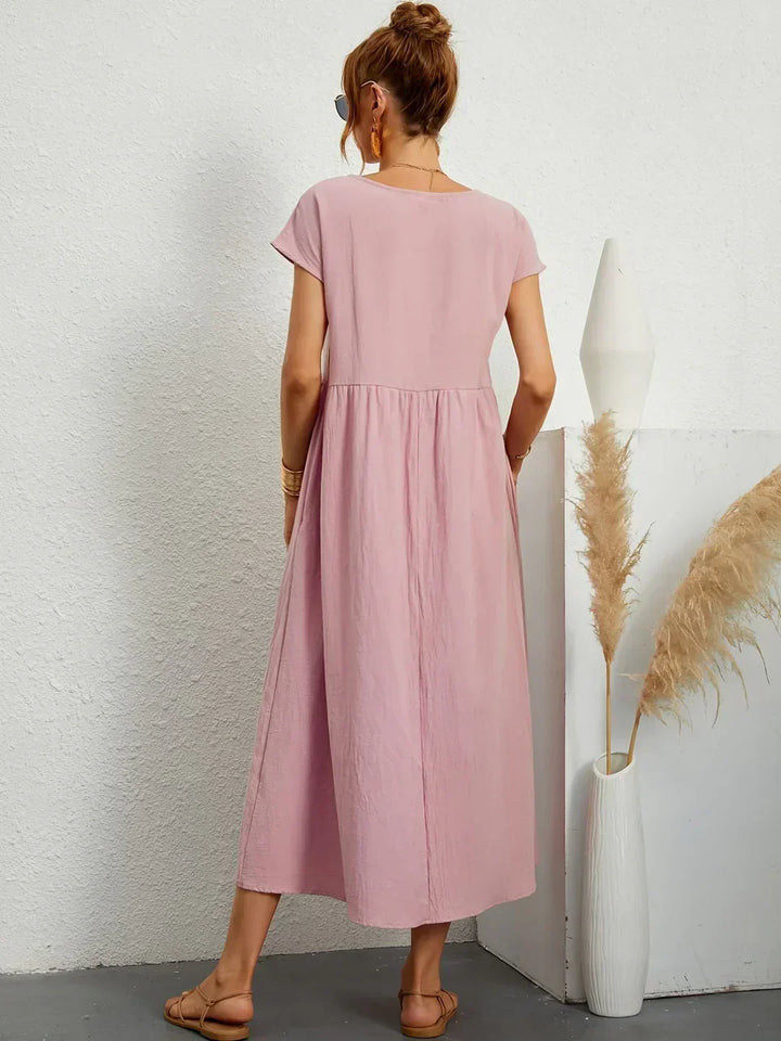 Elegant women's midi dress, flowy and comfortable, perfect for a timeless, effortless look.