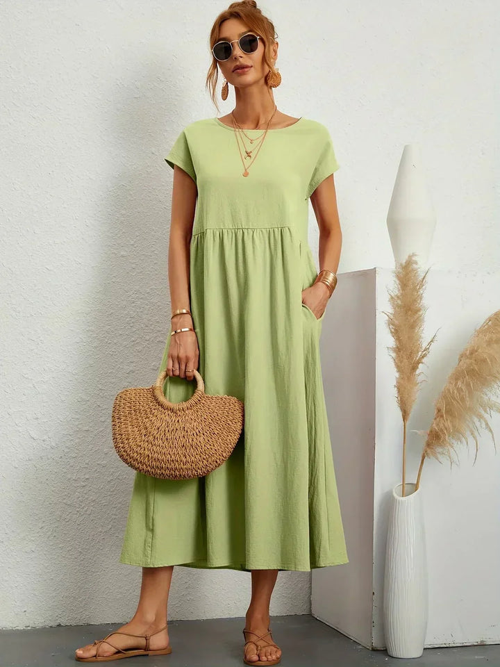 Timeless style women's midi dress, elegant and flowy, offering versatile comfort.