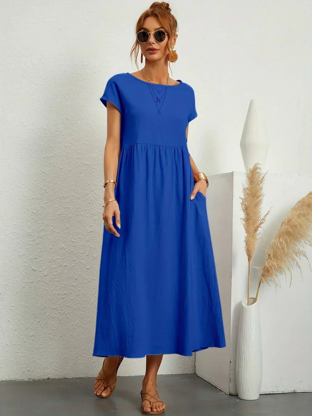 Elegant flowy midi dress for women, perfect as a comfortable and stylish summer dress.