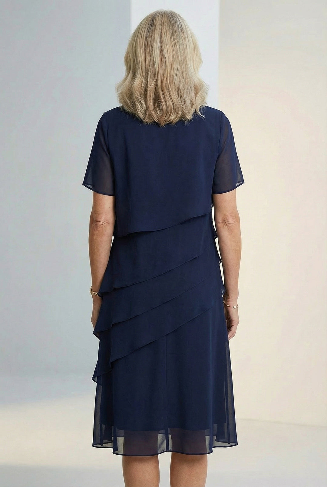 Flowy and comfortable womens midi dress with feminine ruffle details by Elarisse.