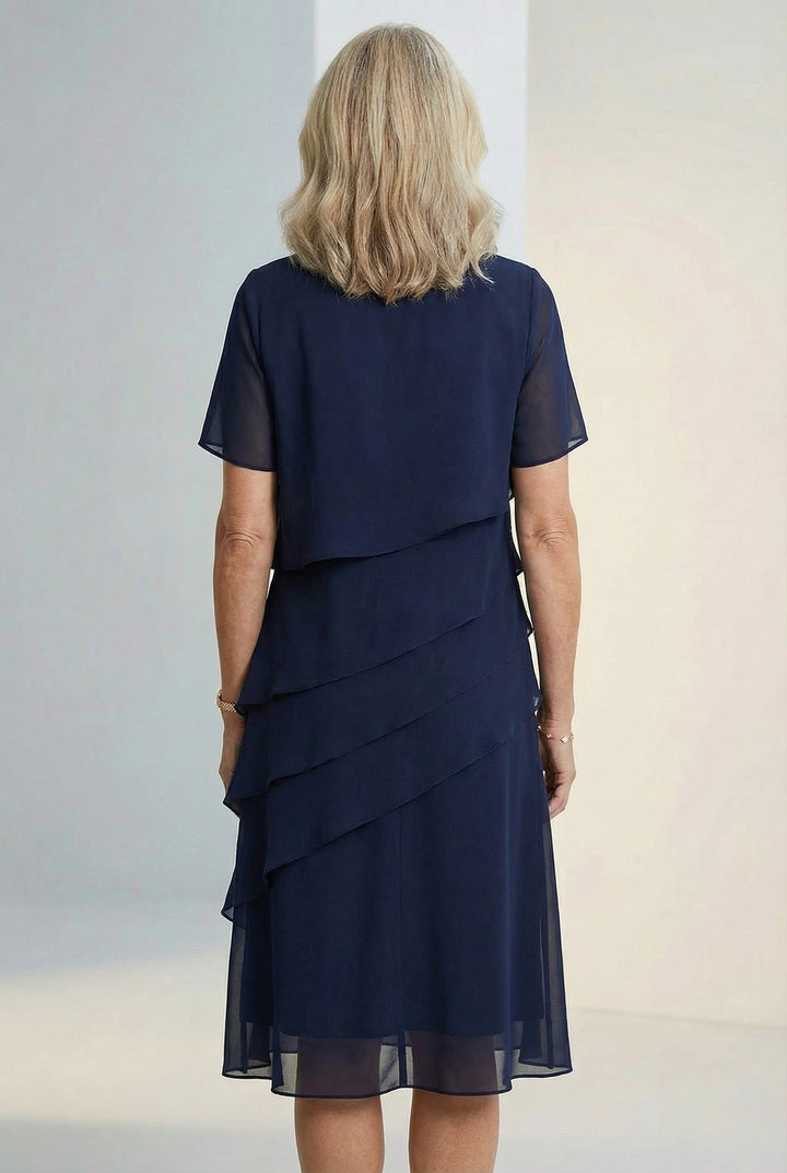 Flowy and comfortable womens midi dress with feminine ruffle details by Elarisse.