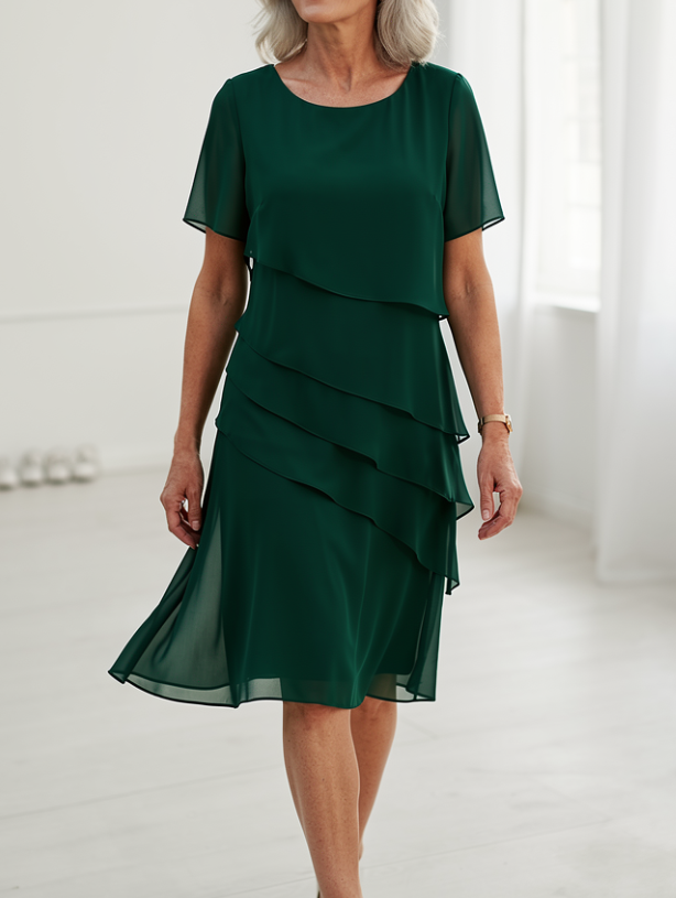 Detail shot of the shoulder ruffles on the feminine Elarisse day to night midi dress.