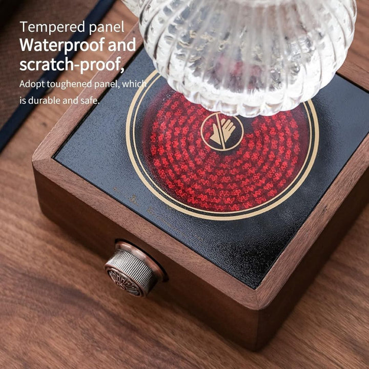 Compact electric tea warmer featuring a beautiful walnut design & adjustable temperature control.