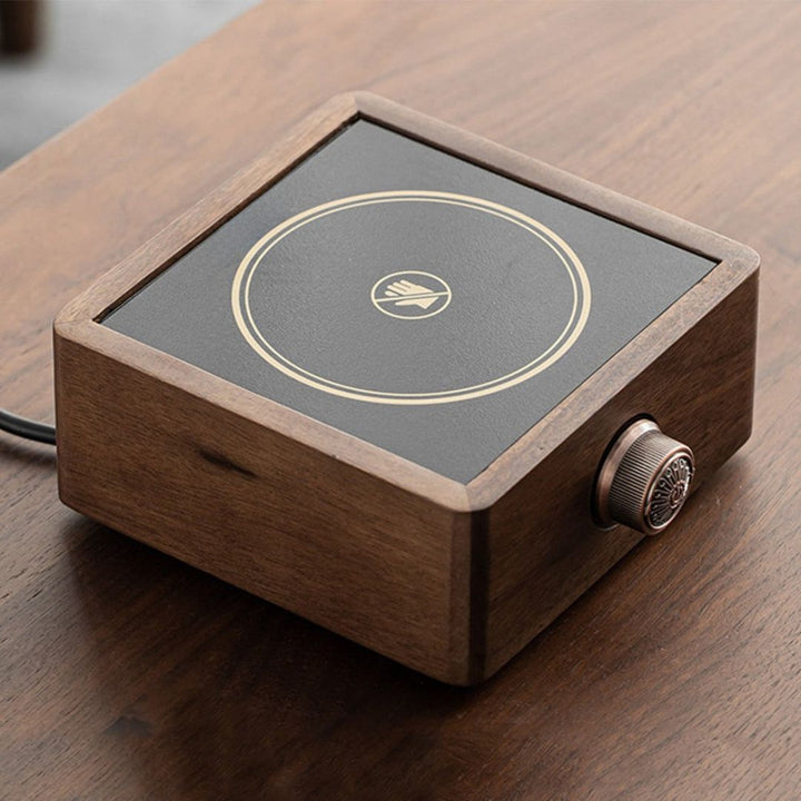 Elegant walnut electric tea warmer; adjustable temperature for stylish home decor & hot beverages.