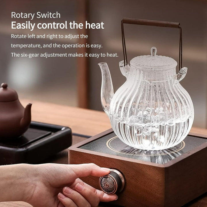 Infrared electric tea warmer with walnut base & adjustable temperature for consistent beverage heat.