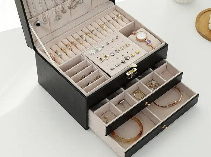 Elegant accessory storage box with three layers, perfect for organizing earrings, bracelets, and rings.