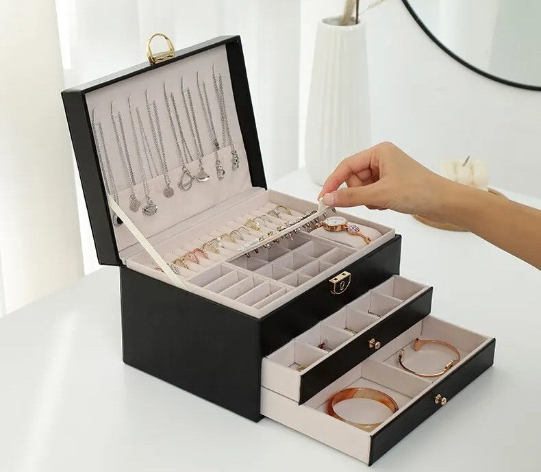 Sophisticated 3-tier jewelry box organizer, ideal for elegant accessory storage and protection.