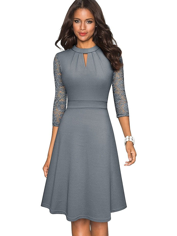 Chic women's elegant A-line party dress, midi length, featuring delicate and intricate 3/4 sleeves.