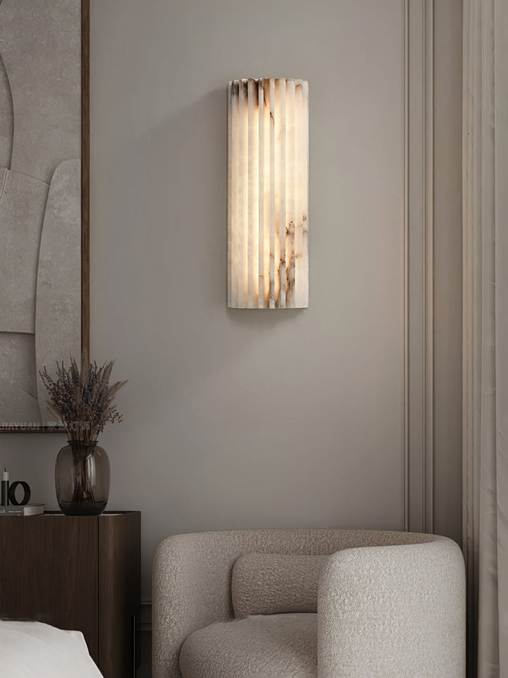 Minimalist alabaster LED wall light, sleek design for contemporary architectural lighting needs.