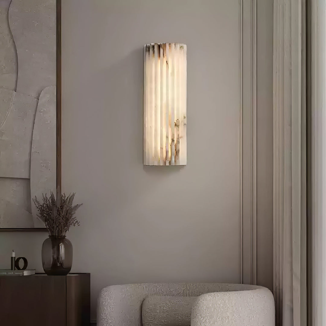 Soft glow alabaster LED wall light, dimmable modern lamp creating a luxury ambiance.