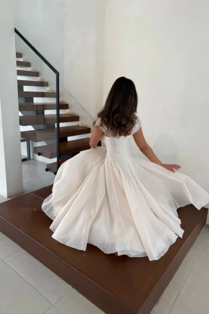 Apricot pink semi-formal party dress for women, elegant midi length with sweetheart neckline & cap sleeves.