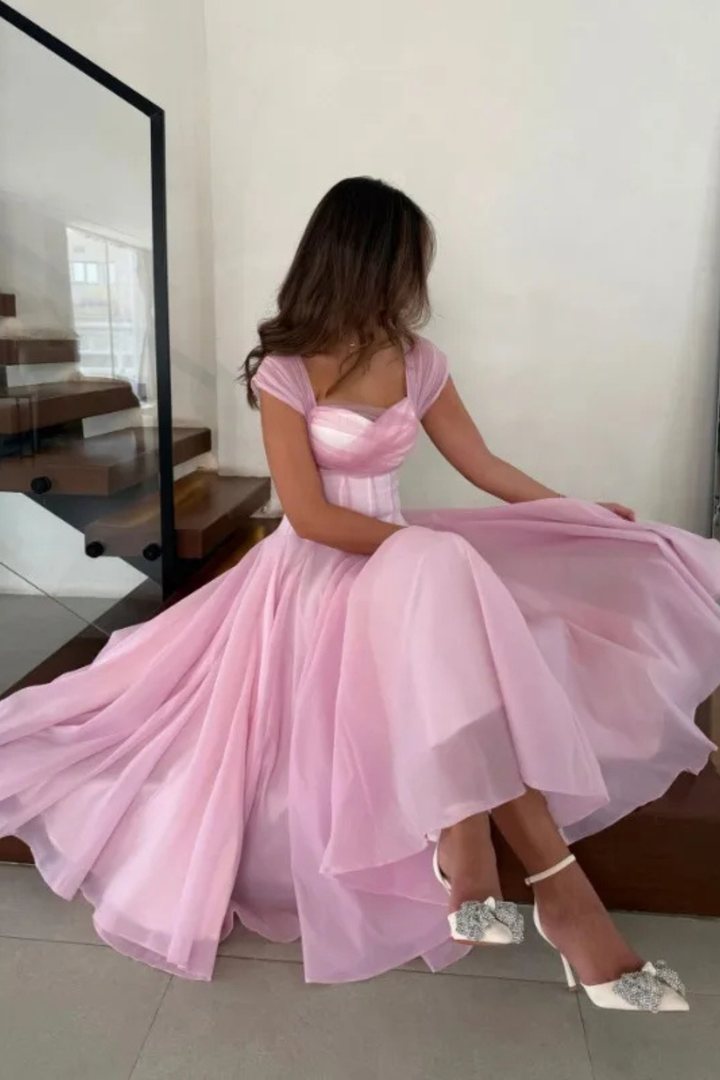 Flattering women's semi-formal midi dress with sweetheart neckline & cap sleeves. Ideal elegant wedding guest attire.