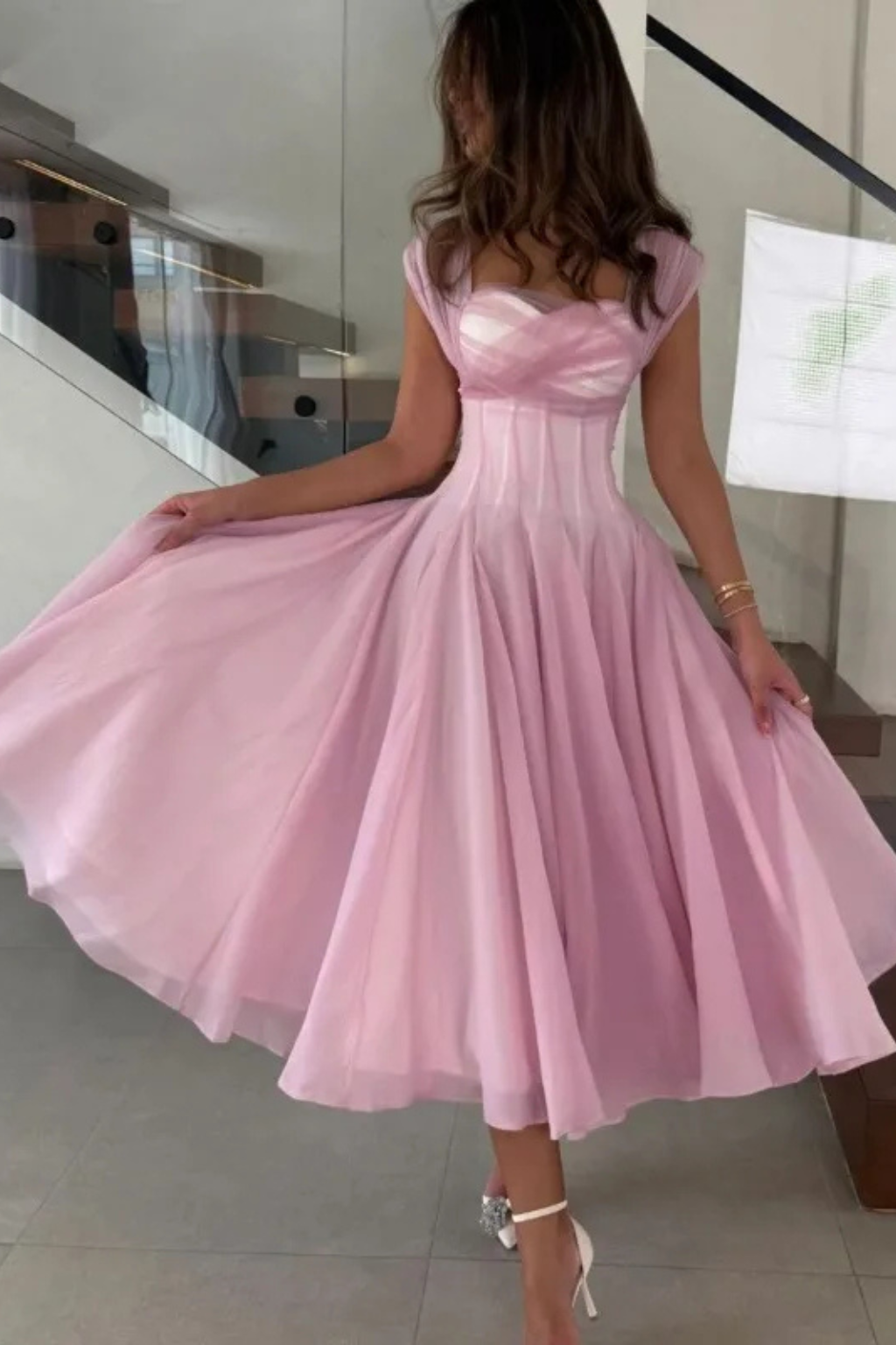 Women's elegant apricot pink midi dress with a sweetheart neckline & cap sleeves, perfect for weddings & parties.