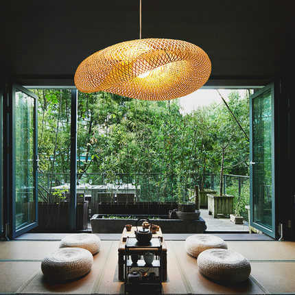 Stylish bamboo pendant light with a beautiful rattan shade, offering warm, inviting home lighting.