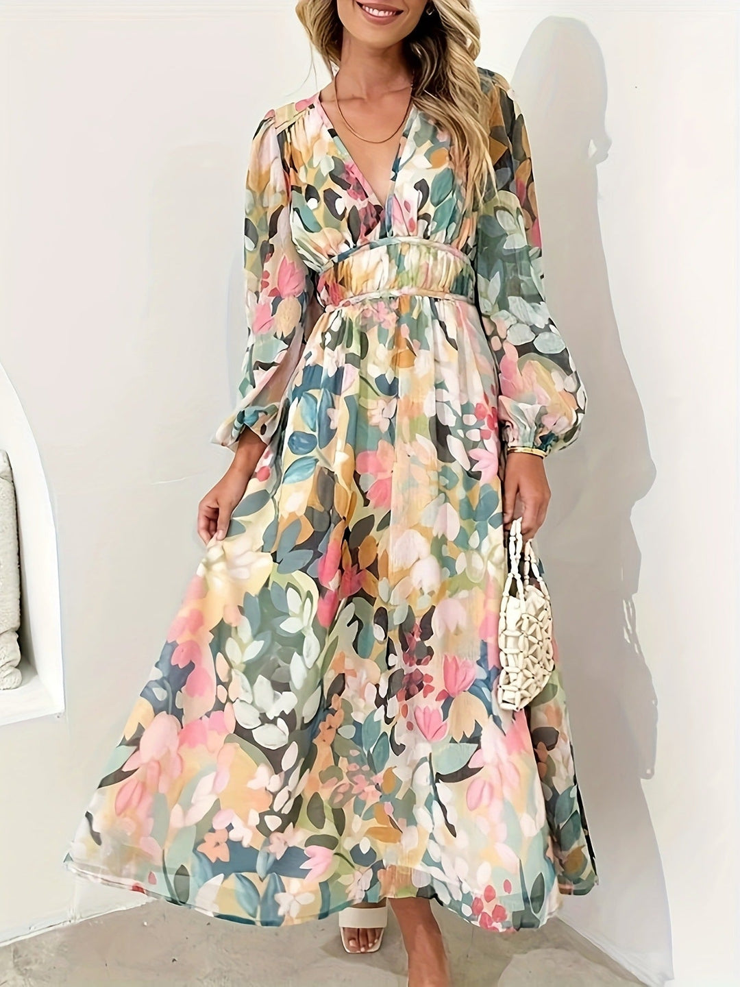 Chic long sleeve midi dress in a delicate floral pattern, perfect for parties.