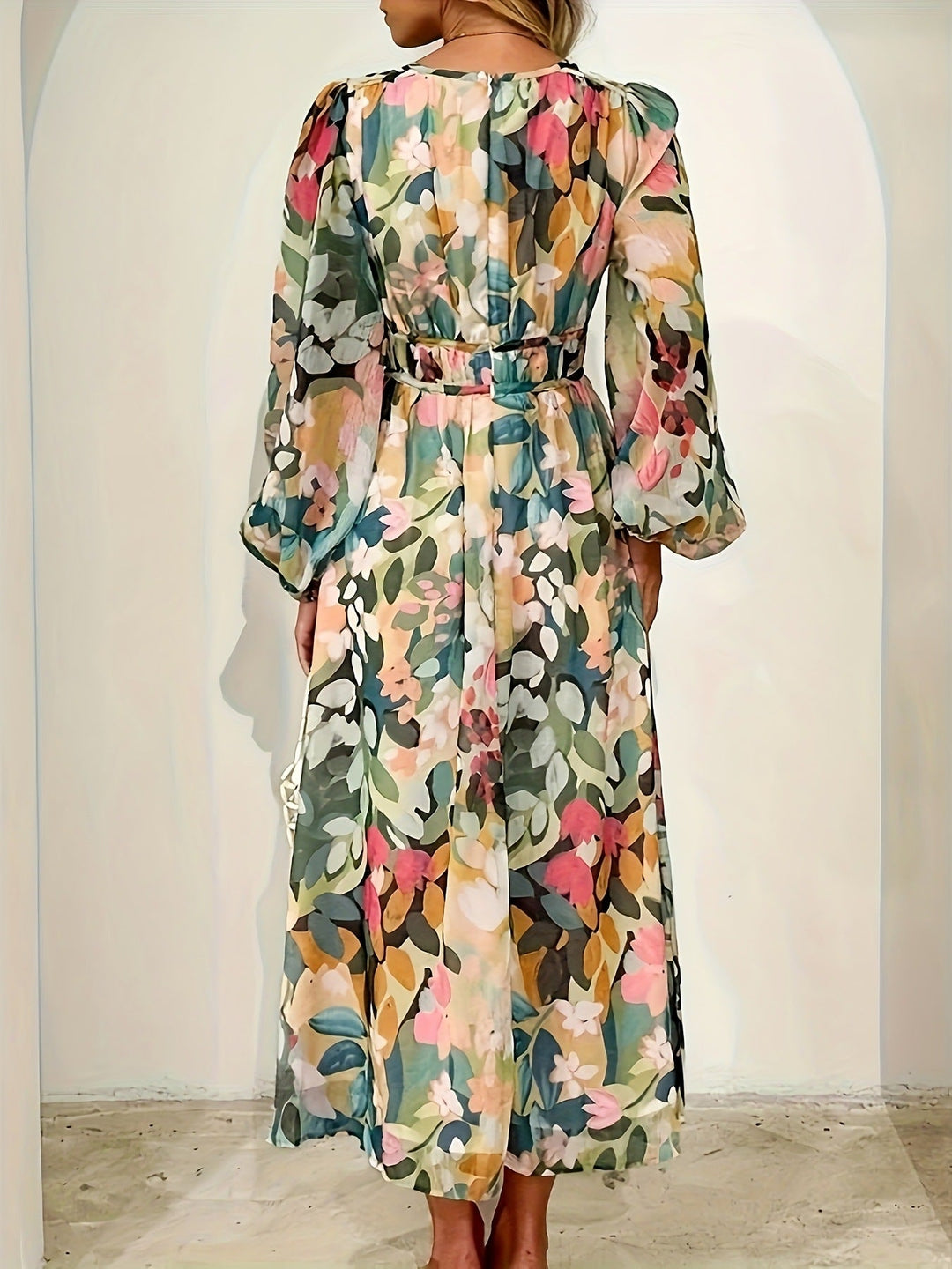 Full view of a floral print long sleeve midi dress, showcasing its elegant design.