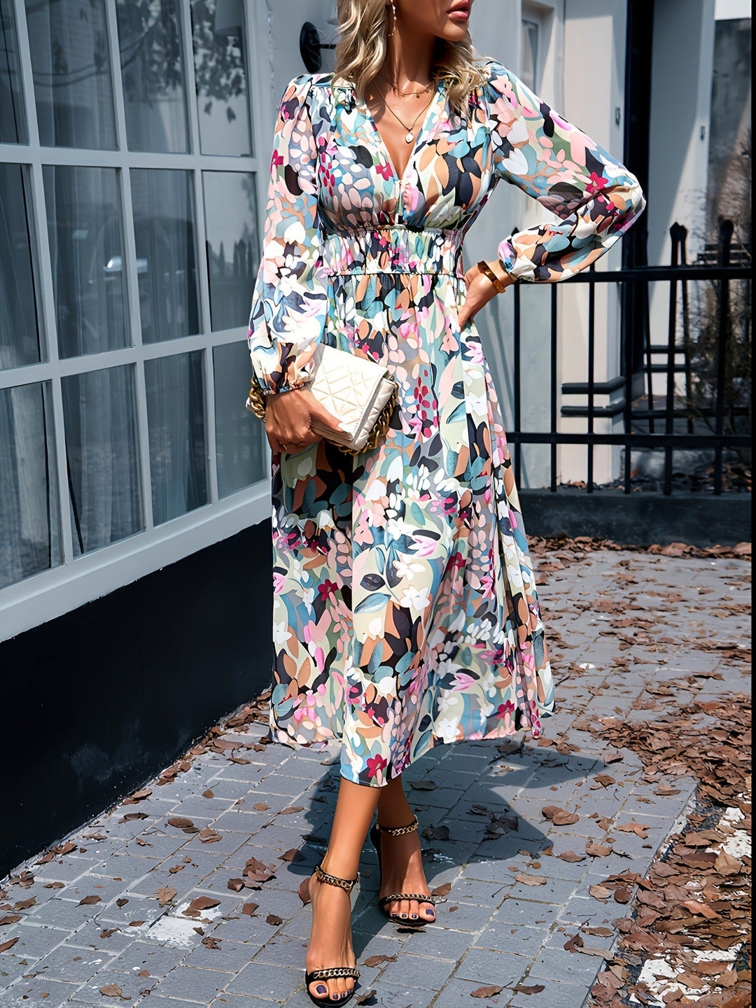 Close-up of the intricate floral pattern on a beige midi dress for wedding guests.