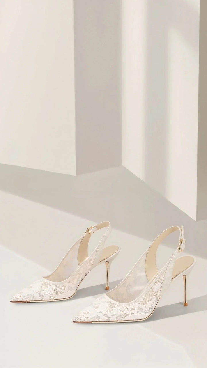 Stylish pointed toe slingback heels crafted from delicate lace, ideal for evening wear.