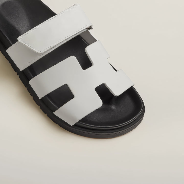 Adjustable leather strap detail on elegant women's sandals, ensuring a secure fit.