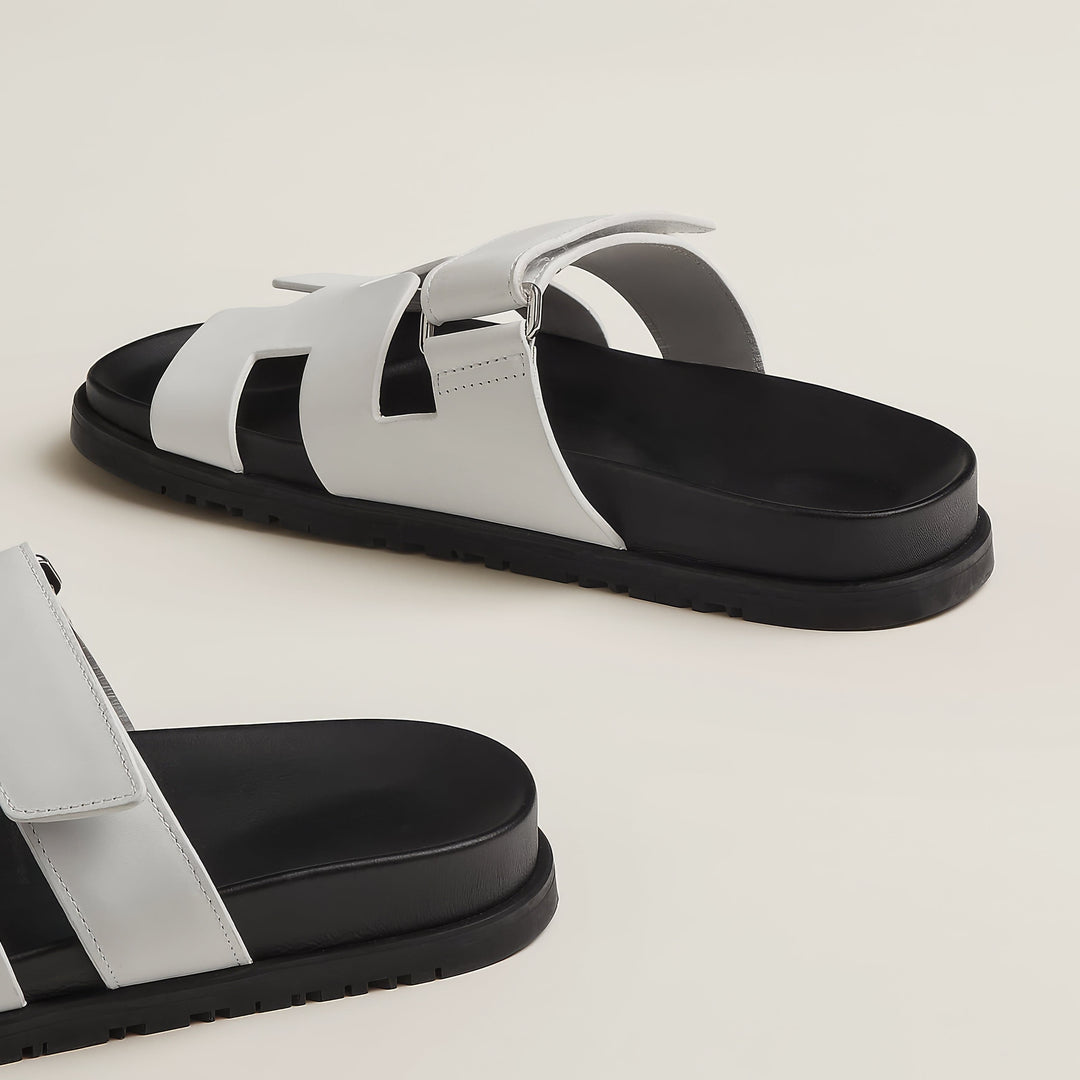 Front view of chic leather strappy sandals, showcasing modern and elegant design.