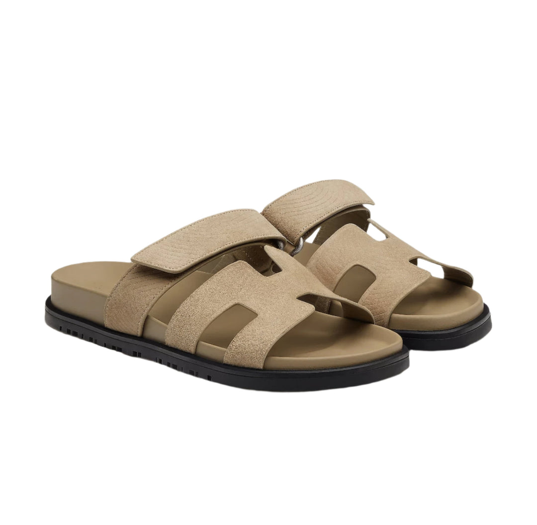 Close-up of adjustable strap on chic women's leather sandals, perfect for summer.