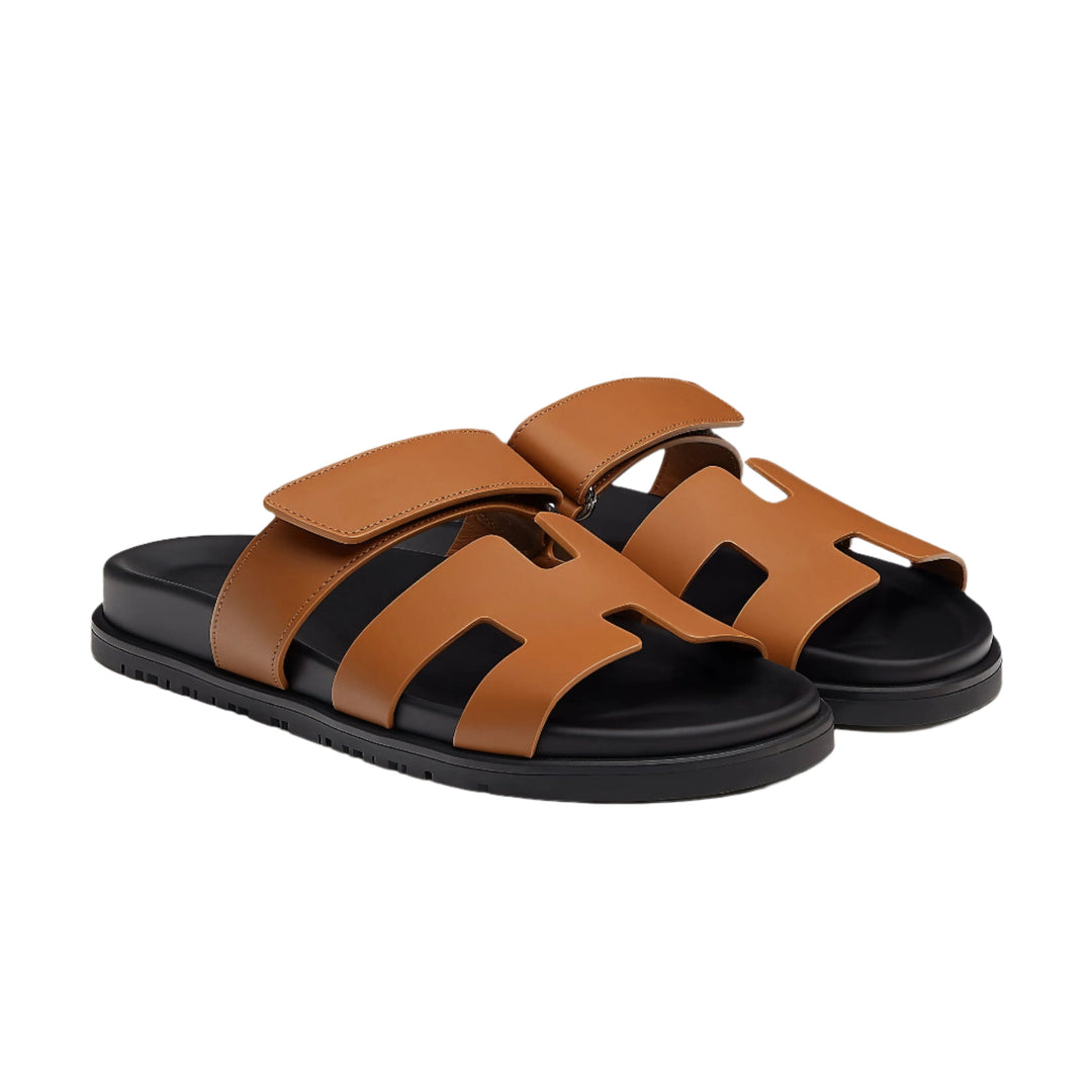 Side view of elegant brown leather sandals with multiple straps, showcasing chic design.