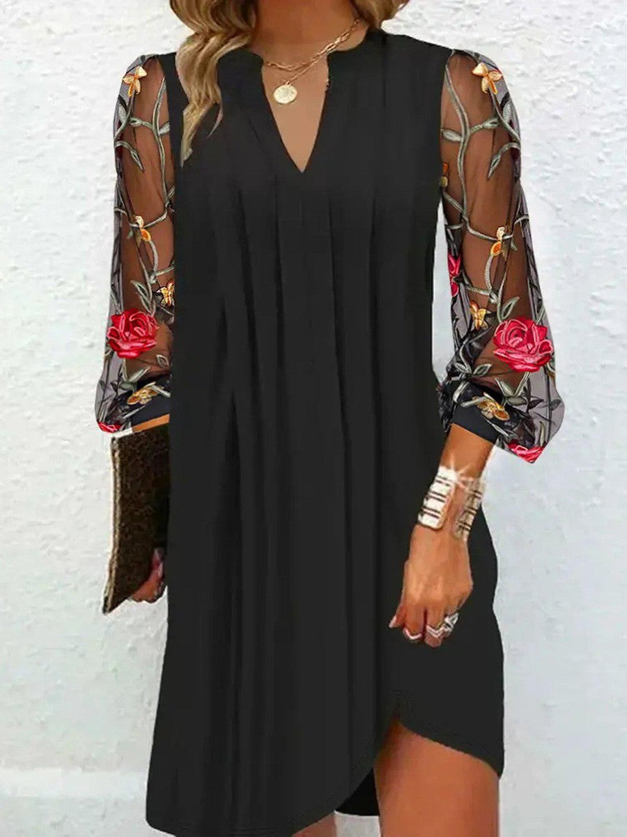 Chic black V-neck women's party dress, showcasing elegant floral sleeves. Ideal for formal and special events.