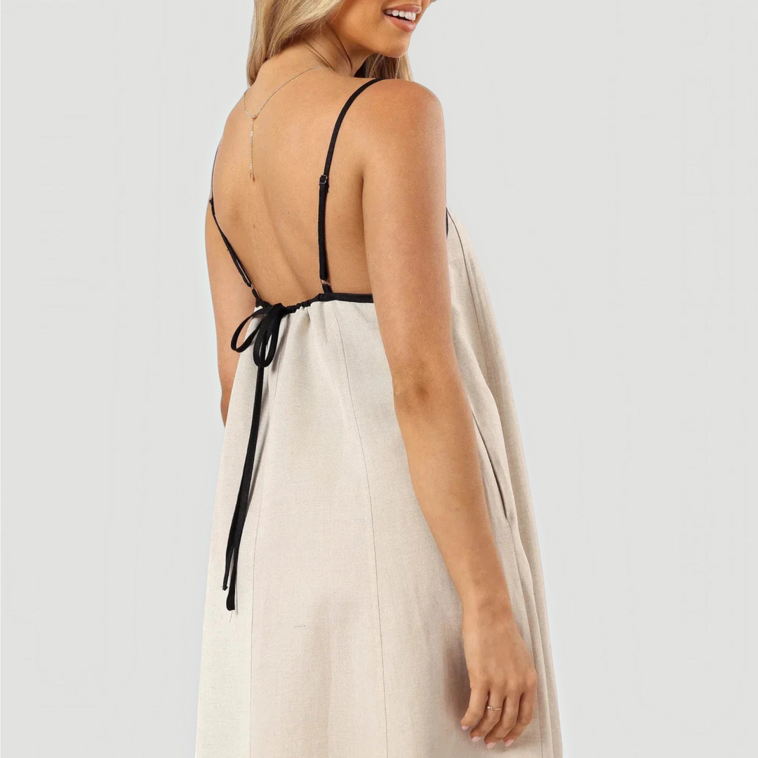 Versatile women's elegant casual summer midi dress; a-line, sleeveless, available in classic black and white.