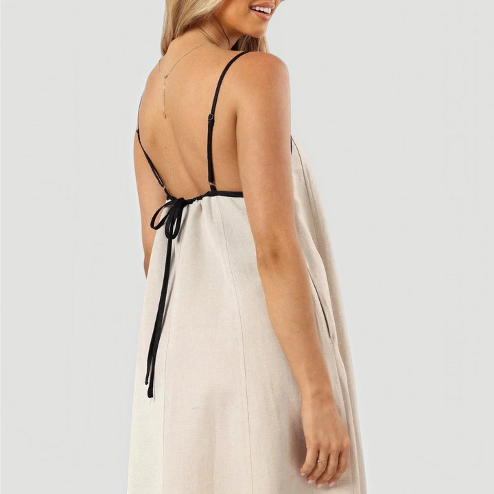 Versatile women's elegant casual summer midi dress; a-line, sleeveless, available in classic black and white.
