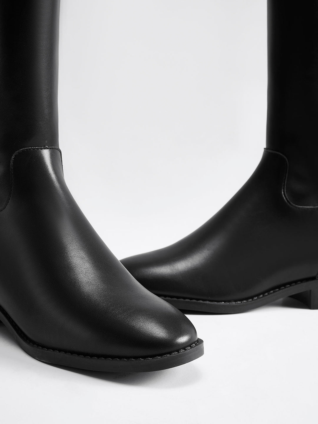 Classic black women's knee-high riding boots. Timeless, comfortable, and elegant for any occasion.