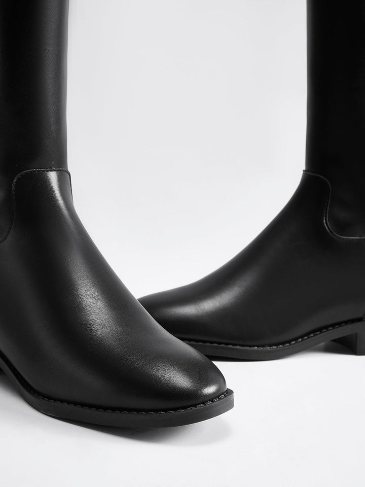 Classic black women's knee-high riding boots. Timeless, comfortable, and elegant for any occasion.