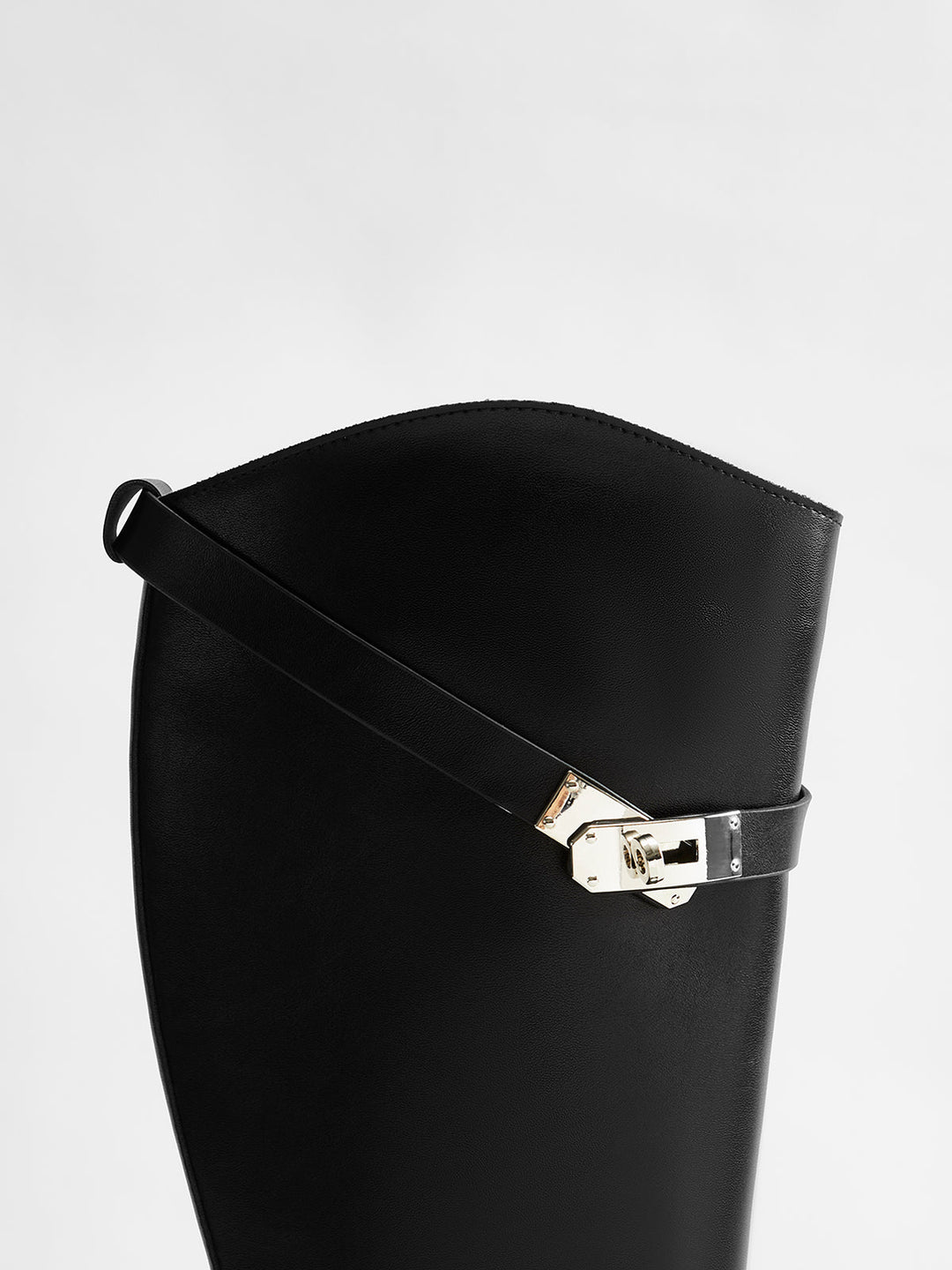 Stylish black knee-high riding boots for women. Elegant tall boots, ideal for sophisticated fall & winter looks.